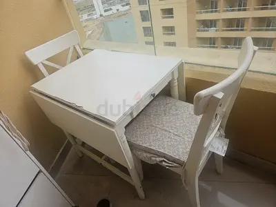 Tablet ikea with 2 chairs and cushions