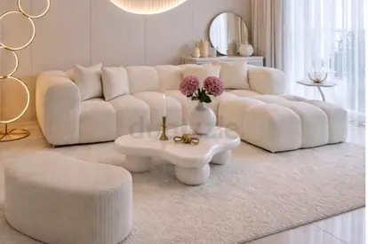 Cream curved modular 4 seater sofa with ottoman