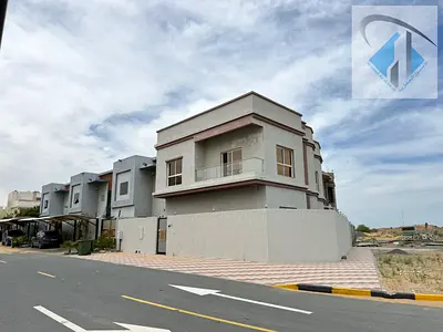 Corner villa with 5 bedrooms for annual rent in Ajman, Al Zahiyah area, on a main street with a large setback.