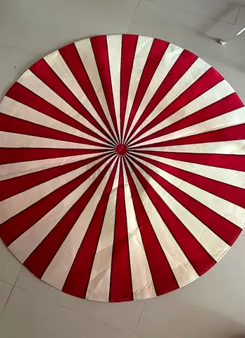 Round red and white striped rug/carpet