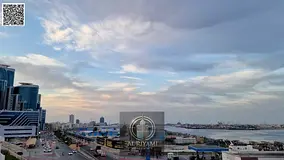 Two-bedroom apartment with a living room and a balcony offering a stunning open view of the port are