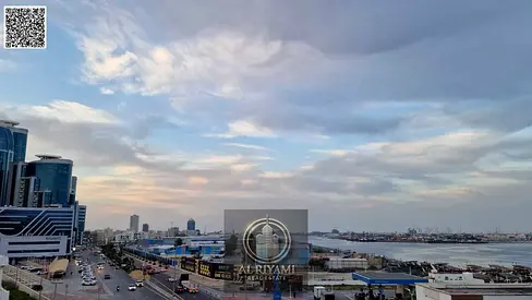 Two-bedroom apartment with a living room and a balcony offering a stunning open view of the port area.