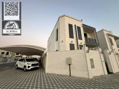 For sale in Al Yasmin, a villa with five master bedrooms, a majlis, a living room with furnishings, a maid's room, and a spacious kitchen.