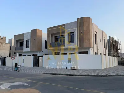 Villa for sale in Ajman | Al Zahiyah area | 5 bedrooms, majlis, 2 living rooms, maid's room, and 2 terraces. Includes electricity and air conditioning