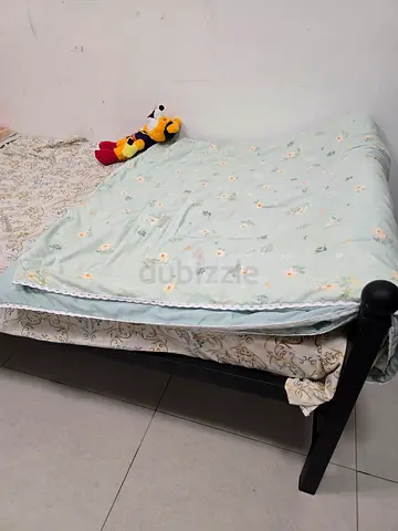 Metal cot without mattress