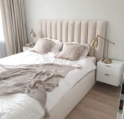 My beige upholstered double bed with tall channel headboard - good condition