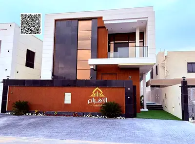 Luxury villa for sale in Al Bahia area, featuring two floors and a rooftop terrace. Modern design, spacious living areas, reception halls