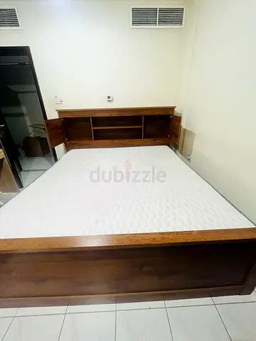 King size bed with storage and mattress for sale.