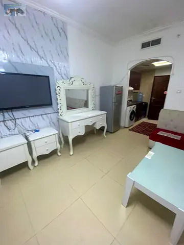 Furnished studio for monthly rent in Yasmeen Towers Ajman, opposite Ajman City Center, clean furniture, private parking, all bills & internet included