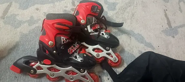 Red/Black Adjustable Inline Roller Skates - Good Used Condition