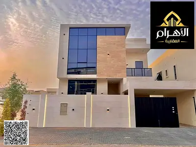Luxury villa in Al Yasmin, Ajman, ready for immediate occupancy, featuring high-end finishes and spacious living areas.