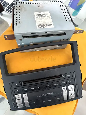Used Mitsubishi Pajero car CD/Radio head unit with dash bezel — sold as seen. CD stuck.