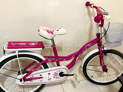 pink kids bike with basket