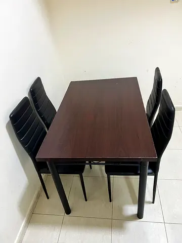 Dining table with 4 black chairs - well kept