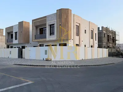 Villa for sale in Ajman | Al Zahiyah area | 5 bedrooms, majlis, 2 living rooms, maid's room, and 2 terraces. Includes electricity and air conditioning
