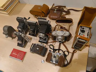 Vintage film camera collection — folding bellows, 35mm  leather cases