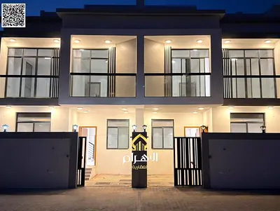 Luxury villa for sale in Al Bahia area, featuring two floors and a rooftop terrace. Modern design, spacious living areas, reception halls, and compreh