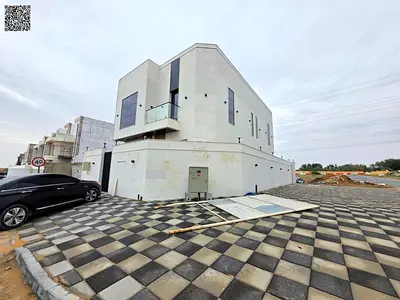 Corner villa on two streets for sale in Al Helio area, Ajman, with a great location close to all services and on a main street. The price includes reg