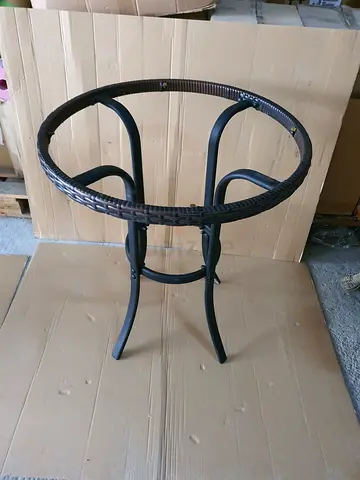 Round rattan-style patio table frame — needs glass top