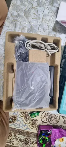 Wireless router in original box — includes power adapter  Ethernet cable Under warranty till August