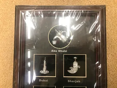 Framed UAE souvenir plaque with Abu Dhabi, Dubai  Sharjah emblems