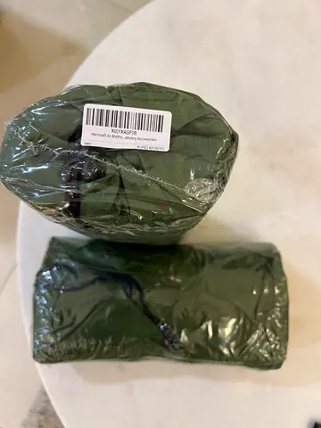 Two sealed olive-green compact inflatable mattresses (unused)