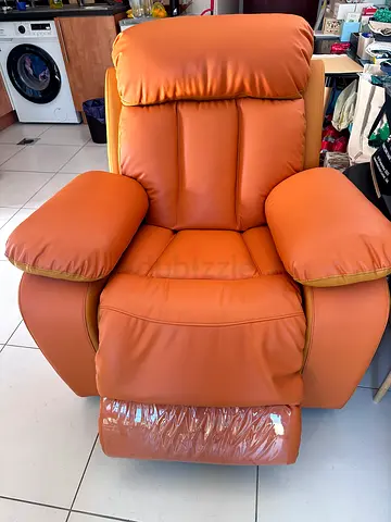 My brown faux-leather recliner armchair with footrest - good condition