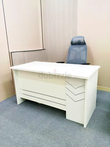 White executive office desk with ergonomic mesh chair