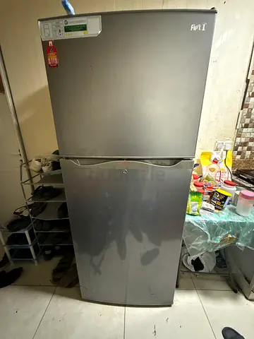 Silver double-door refrigerator/freezer - good working condition