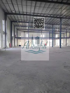 A prime warehouse in the Emirate of Umm Al Quwain, located in a specific industrial and commercial a