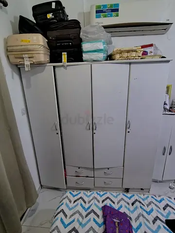 White 4‑door wardrobe/armoire with drawers — used