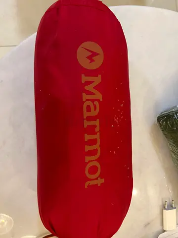 My Marmot red sleeping bag (packed) - compact and lightweight. Duck down, -15 C, mummy