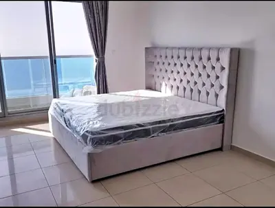 My light grey upholstered double bed with mattress - used, good condition