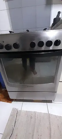 Stainless steel freestanding cooker 4 burners(oven + hob) - good working condition with lid to cover