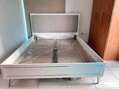 White modern bed frame with upholstered headboard – like new