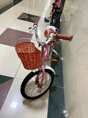 Selling my pink childrens bike with front basket and rear rack
