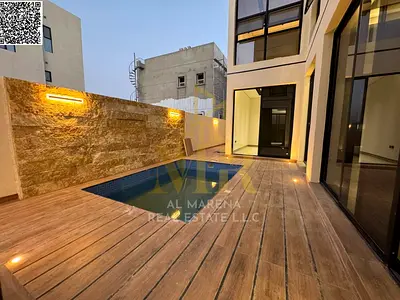 Luxury villa in Al Bahia, two floors and a rooftop with a private pool, in the heart of Ajman, close to amenities, including registration and ownershi