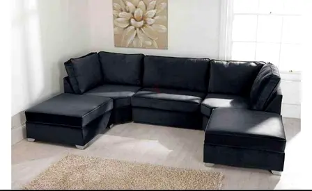 Dark grey L-shaped sectional sofa with two ottomans