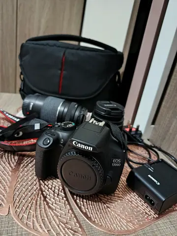 Canon EOS1300d camera with extra lense and digipod