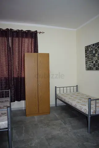 Bed space furnished In a big room in shabiya