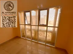 A large room and living room with 2 bathrooms in Al Muwaihat 3 area, close to all services and main