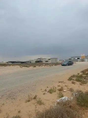 Industrial corner plot for sale in Sharjah, Al Sajaa area.