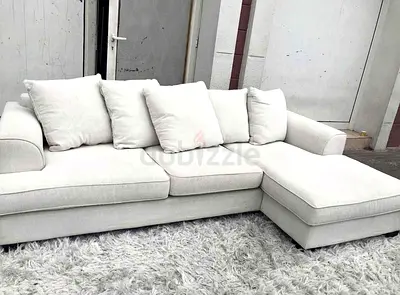 Light beige L-shaped sectional sofa with chaise