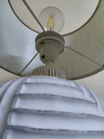 White fabric table lamp with ribbed ceramic base