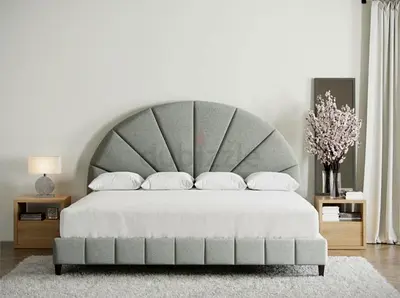 grey upholstered bed with sunburst headboard
