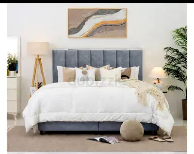 My grey upholstered bed frame with padded headboard