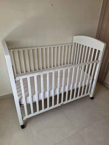 Babyshop Juniors white Wooden Baby Crib on Wheels - Gently Used
