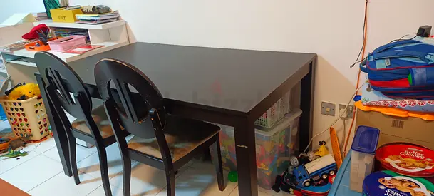 Im selling my dark wood dining table with drawers and chairs