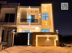 Villa for sale in Ajman, two floors and a roof, at a bargain price including fees. Excellent locatio