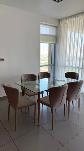 The glass dining table with 6 chairs